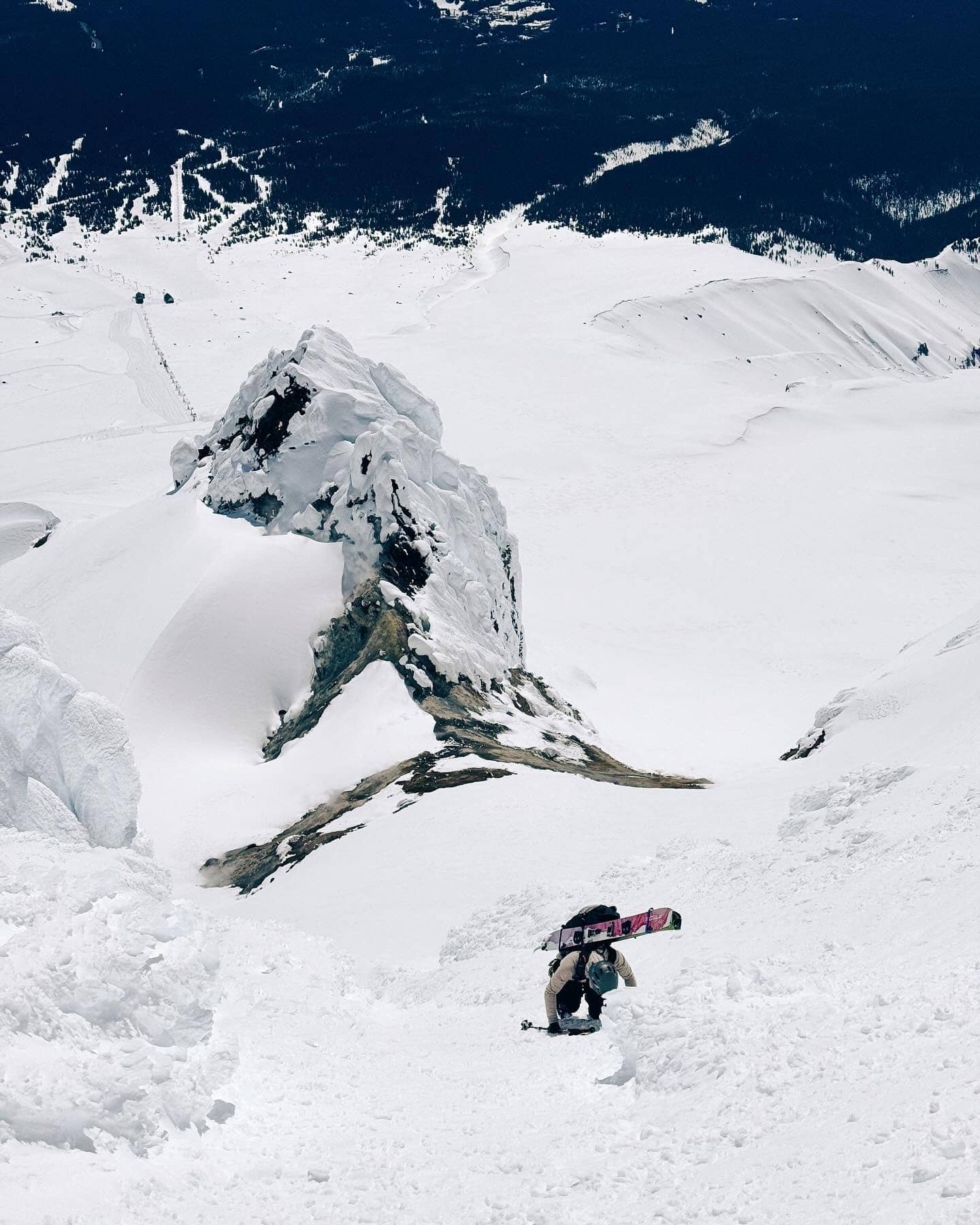 Char Surio climbing a mountain with a splitboard.