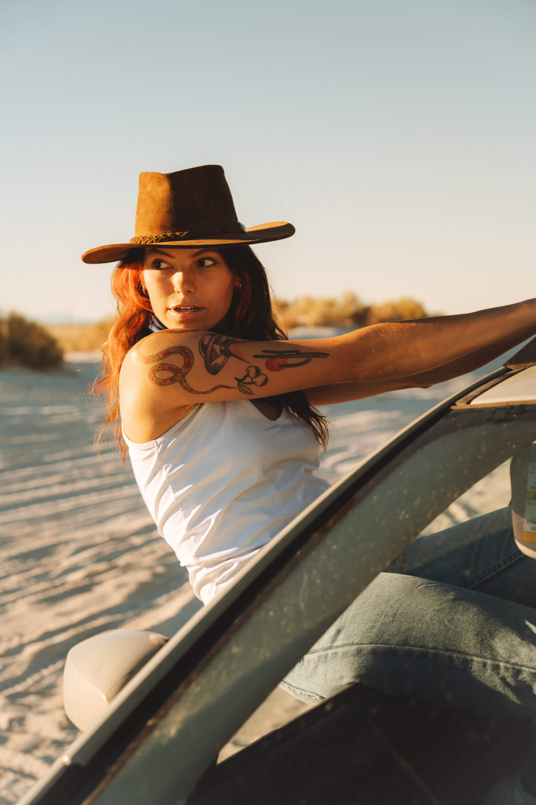 AJ Cutler leaning out of her car.