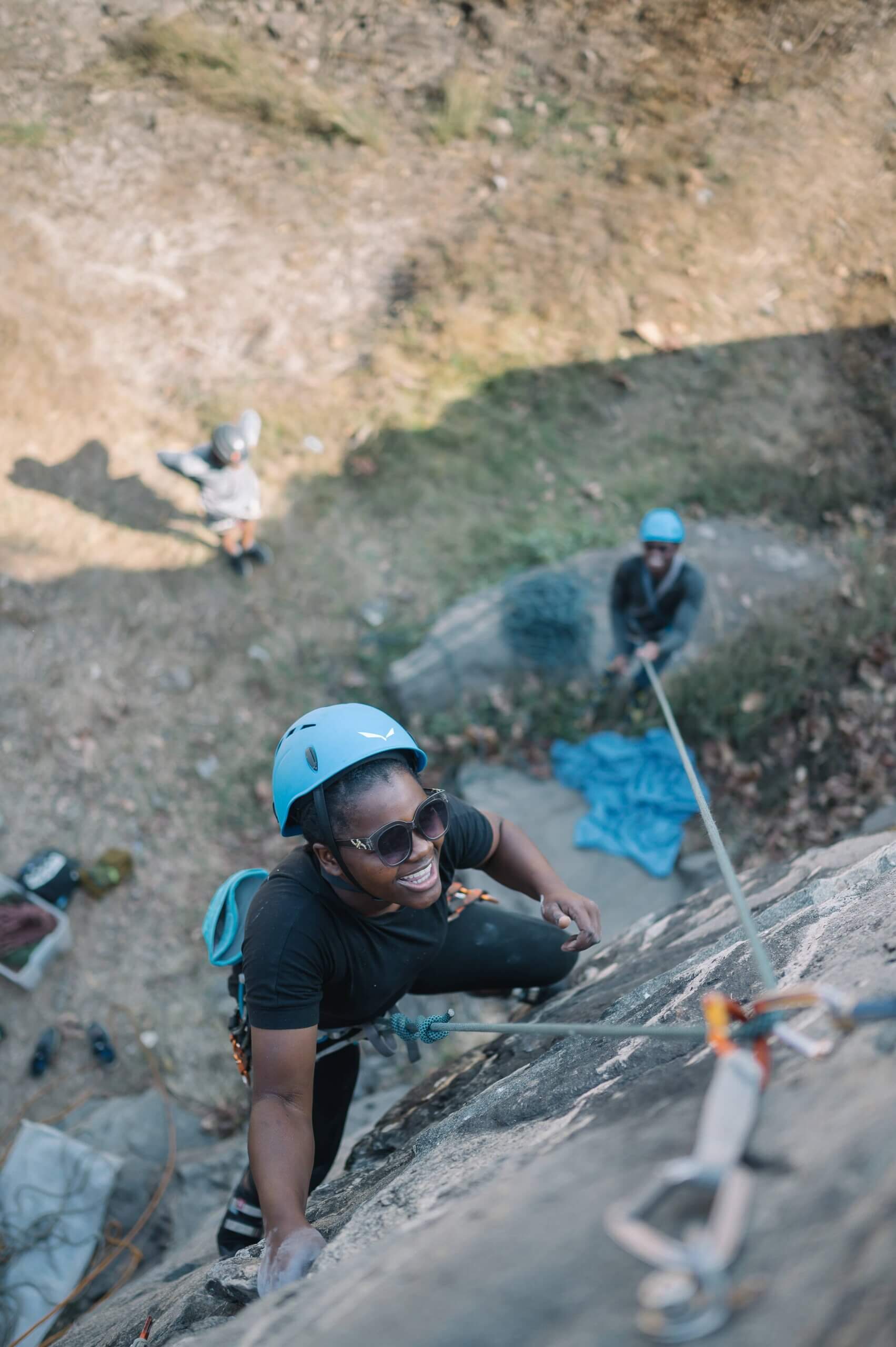 Shalom Maholo climbing outside in Malawi.